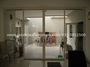 Pintu sliding aluminium YKK kaca 5mm East Wood Citraland Surabaya